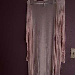 I’m selling a pink long cardigan with medium sleeves